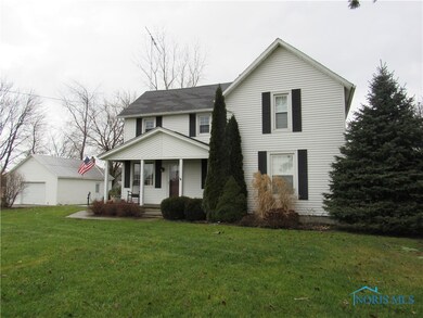 Updated home with dethatched garage, large barn,and pole barn.