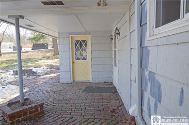 Covered back brick patio...door to the garage