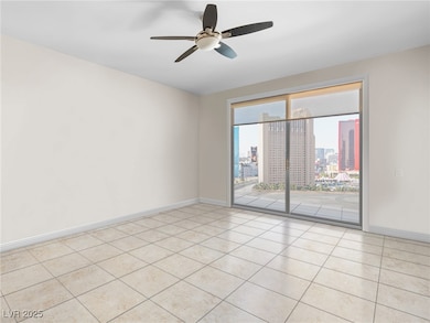 Empty room featuring light tile patterned floors,