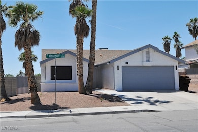 View of front facade with a garage, driveway, and