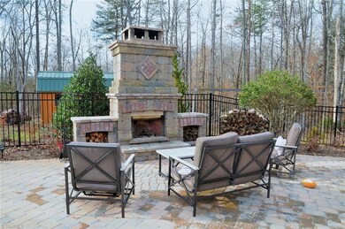 Outdoor living space with stone fireplace