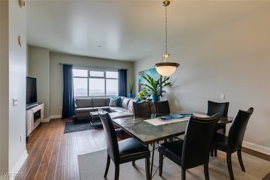 Dining room with baseboards and wood finished floo