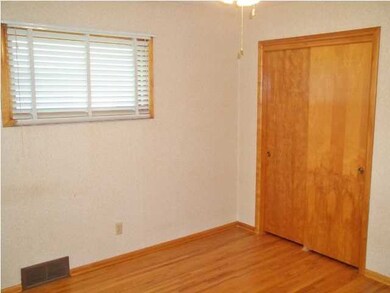 Master bedroom has wood floors and ample closet sp