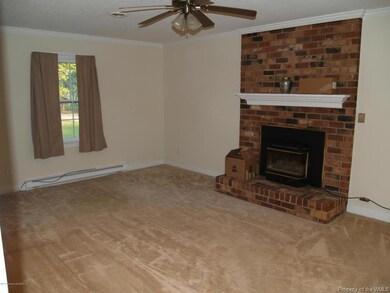 Gas Log Insert in Brick Fireplace in Fam