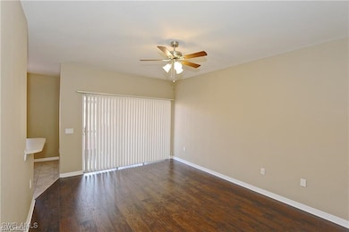 Empty room with baseboards, wood finished floors,