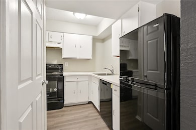 Reverse of the kitchen featuring under cabinet ran