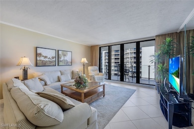 Living room featuring floor to ceiling windows, or