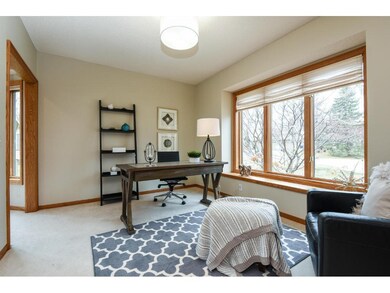 Off the foyer to your right, an expansive office i