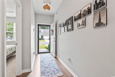 Entryway with wood finished floors