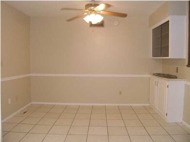 The dining area includes easy care tile flooring a