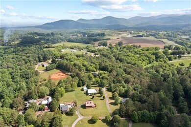 Aerial view of a mountainous background and a heavily wooded area