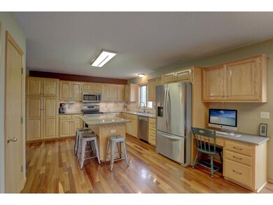 Large kitchen with ample storage, stone counters a