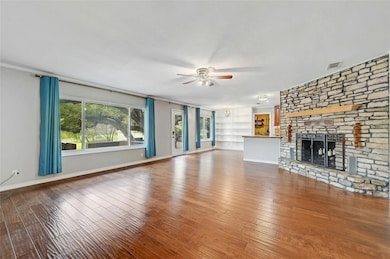 Unfurnished living room with a fireplace, visible