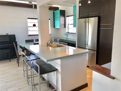 Quartz counters and stainless steel appliances.