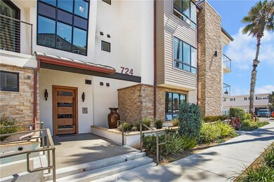 Contemporary architecture with fountain and secured entrance lobby utilizing intercom system for guest entry.
