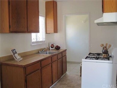 Kitchen leading to laundry room and side entrance