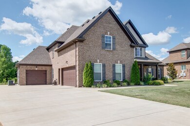 2 car garage plus separate carriage garage. Expanded driveway for extra parking!