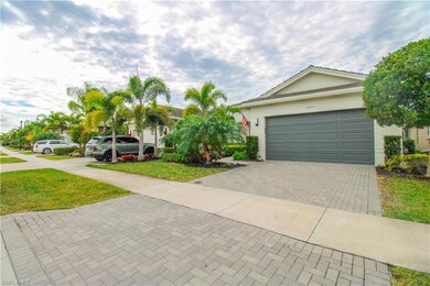 Ranch-style house with a front yard and a garage