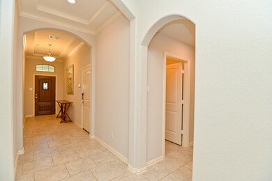 Crown molding and eyebrow archways throughout.