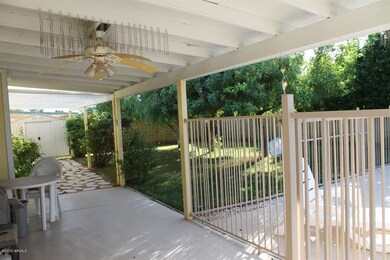 Large covered patio & shade trees