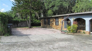 Front, additional parking pad/patio area