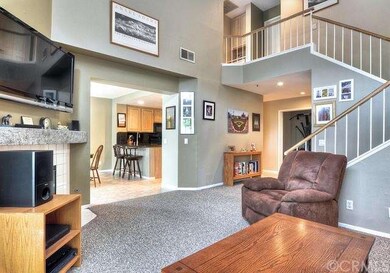 LIVING ROOM: IT FEATURES SOARING CEILINGS, FULLY E