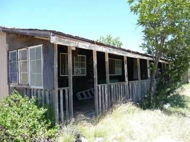 Covered front porch facing S