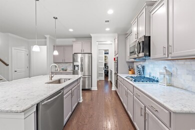 Kitchen with dark hardwood / wood-style flooring, 