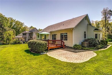Back yard has both a deck and a paver patio