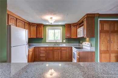Newer appliances and granite in the kitchen as wel