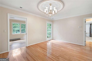 The dining room opens to the relaxing sunroom.