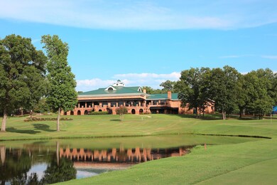 View of community with a lawn and a water view