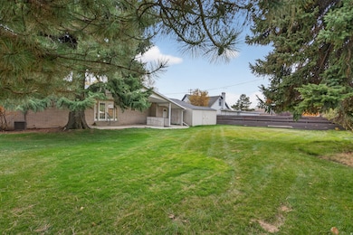 View of the large, secluded yard featuring a patio