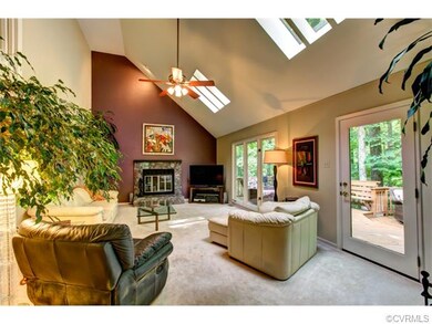 The family room has two large skylights, carpet, c