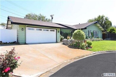 Large two car garage with a roll up door and off s