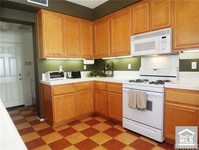Spacious kitchen with ample maple cabnitery