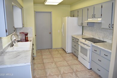 Kitchen with newer Glass Top Stove and R