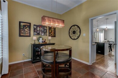 The tile flooring continues to the formal dining r