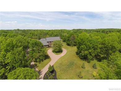 Exterior Front. Follow the cobblestone driveway to