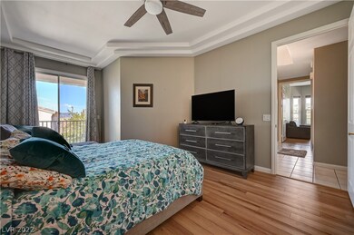The spacious master bedroom features a balcony