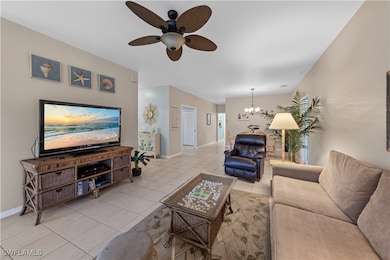 Tiled living area featuring baseboards and ceiling