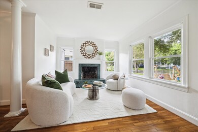 Formal living room with a fireplace.