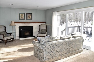 The kitchen opens to the light-filled living room,