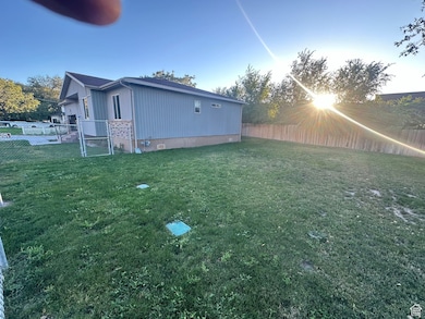 View of fenced backyard