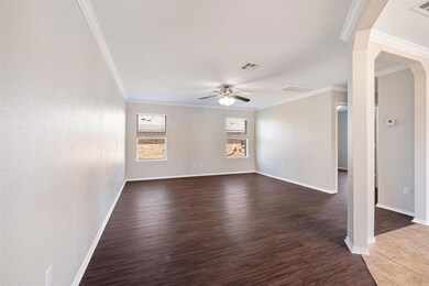 Spare room with wood finished floors, baseboards,