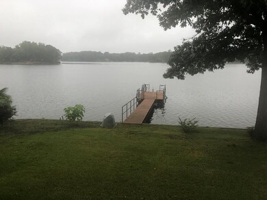 Lake side view of home, covered porch on left