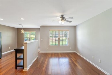 LIVING ROOM: This open and airy layout boasts new 