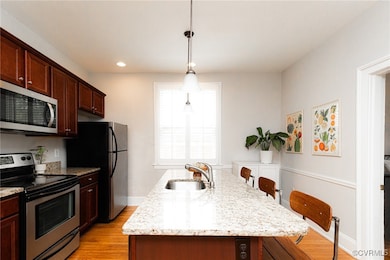 Kitchen with appliances with stainless steel finis