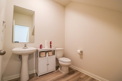 Half bathroom, located on the first floor at the f