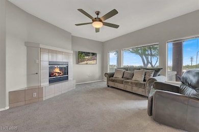 Living room with baseboards, a wealth of natural l